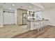 Modern kitchen with stainless steel appliances, stone countertops, and a breakfast bar at 108 Shawville Ln, Peachtree City, GA 30269