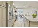 Bright kitchen featuring stainless steel appliances, granite countertops, tile backsplash, and an island with bar seating at 108 Shawville Ln, Peachtree City, GA 30269