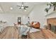 Open concept living space with brick fireplace, hardwood floors and lots of natural light at 108 Shawville Ln, Peachtree City, GA 30269