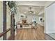 Bright living room featuring vaulted ceilings, hardwood floors, and a cozy fireplace at 108 Shawville Ln, Peachtree City, GA 30269