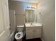 Bathroom featuring a vanity, mirror, sink, toilet, and shower/tub combination at 124 Sparkling Spring Trl, Mcdonough, GA 30252