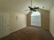 Cozy bedroom featuring plush carpeting, a vaulted ceiling, and a window for natural light at 124 Sparkling Spring Trl, Mcdonough, GA 30252