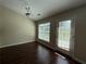 Bright breakfast nook with wood flooring, a modern light fixture, and a door to the outside at 124 Sparkling Spring Trl, Mcdonough, GA 30252