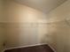 Empty walk-in closet features ample shelving to maximize storage and organization at 124 Sparkling Spring Trl, Mcdonough, GA 30252