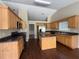 Well-appointed kitchen with wooden cabinets, granite countertops, stainless steel appliances, and an island at 124 Sparkling Spring Trl, Mcdonough, GA 30252