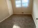 Cozy bedroom with neutral walls, carpet, and natural light from the window at 1905 Robinhill Ct, Tucker, GA 30084