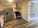Modern kitchen with stainless steel appliances, white cabinets, and modern hardwood floors at 1905 Robinhill Ct, Tucker, GA 30084