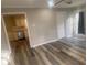 The Living Room has wood-look flooring and adjoins the kitchen at 1905 Robinhill Ct, Tucker, GA 30084