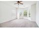 Bright bedroom with a ceiling fan and a bay window offering ample natural light at 2717 High Creek Run, Dacula, GA 30019