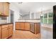 Kitchen with wood cabinets, granite countertops and stainless steel appliances at 2717 High Creek Run, Dacula, GA 30019