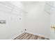 Walk-in closet with built-in wire shelving and wood-look laminate flooring at 2717 High Creek Run, Dacula, GA 30019