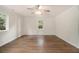 Bright bedroom with hardwood floors, natural light, and a ceiling fan at 3294 Renault Se Rd, Atlanta, GA 30354