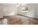 Spacious living room with hardwood floors and a window offering a view of the backyard at 3294 Renault Se Rd, Atlanta, GA 30354