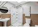 This bathroom has a glass enclosed shower, pedestal sink, and modern toilet at 3665 Pine St, Atlanta, GA 30340