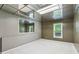 Unfurnished bedroom featuring a window and a large mirror at 3665 Pine St, Atlanta, GA 30340