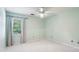 Neutral bedroom features a window and a ceiling fan at 3665 Pine St, Atlanta, GA 30340