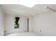 This bedroom features neutral carpeting, a large window, and a closet for ample storage at 3665 Pine St, Atlanta, GA 30340