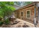 Inviting stone-accented entrance featuring a tiled patio, providing a charming and sheltered entryway to the home at 3665 Pine St, Atlanta, GA 30340