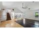 Bright living room with stairs, an open floor plan, and large windows providing views of the outdoors at 3665 Pine St, Atlanta, GA 30340