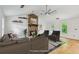 Staged living room with a stone fireplace, ample seating, and lots of natural light at 3665 Pine St, Atlanta, GA 30340