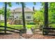 Large backyard featuring a two-story home with a deck, accessible via wooden stairs, creating outdoor living at 3944 Blustery Ne Way, Marietta, GA 30066