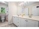 Bathroom featuring double vanity, neutral color, and a separate toilet and shower area at 3944 Blustery Ne Way, Marietta, GA 30066