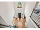 Grand foyer showcases high ceilings, hardwood floors, a chandelier, and a staircase to the upper level at 3944 Blustery Ne Way, Marietta, GA 30066
