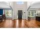 Elegant foyer boasts hardwood floors, an open floor plan, and arched entryways leading to adjacent rooms at 3944 Blustery Ne Way, Marietta, GA 30066