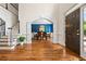 Welcoming foyer features hardwood floors, elegant archways, a staircase, and a dining room in view at 3944 Blustery Ne Way, Marietta, GA 30066