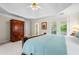 Luxurious main bedroom features a tray ceiling, access to the balcony, and neutral decor at 3944 Blustery Ne Way, Marietta, GA 30066