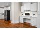 Convenient office nook with custom built-ins, desk space, and easy access to the kitchen at 3944 Blustery Ne Way, Marietta, GA 30066