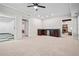 Bright recreation room with dark wood cabinets, sink, mini fridge, and access to additional rooms at 3944 Blustery Ne Way, Marietta, GA 30066