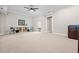 Spacious recreation room with neutral carpet, black and white art, and a small beverage area at 3944 Blustery Ne Way, Marietta, GA 30066