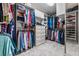 Spacious walk-in closet with custom shelving and ample storage for clothes and accessories at 3944 Blustery Ne Way, Marietta, GA 30066