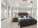 Spacious main bedroom features a decorative tray ceiling and large picture window at 379 Morgan Rd, Carrollton, GA 30116
