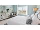 Tastefully designed bedroom featuring light blue walls and a comfortable seating area at 379 Morgan Rd, Carrollton, GA 30116