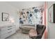 Beautiful Bedroom features modern floral wallpaper, a gray crib and rocking chair at 379 Morgan Rd, Carrollton, GA 30116