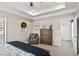 A bedroom featuring decorative ceilings, an accent chair, and an adjacent room at 379 Morgan Rd, Carrollton, GA 30116