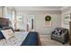 Bedroom with a decorative chair, decorative pillows, and a plush carpet at 379 Morgan Rd, Carrollton, GA 30116