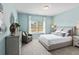 Stylish bedroom boasts natural light, neutral tones, and comfortable decor at 379 Morgan Rd, Carrollton, GA 30116