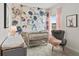 Charming Bedroom with floral wallpaper, cozy crib, and comfortable rocking chair at 379 Morgan Rd, Carrollton, GA 30116