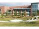 Exterior of red brick building, manicured lawn with trees and small amphitheater at 379 Morgan Rd, Carrollton, GA 30116