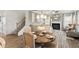 A view of the dining area, living room with fireplace, and staircase at 379 Morgan Rd, Carrollton, GA 30116