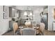 Bright kitchen and dining area with stainless steel appliances and seating for four at 379 Morgan Rd, Carrollton, GA 30116