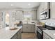 Well-equipped kitchen with stainless steel appliances, granite counters, and plenty of cabinet space at 379 Morgan Rd, Carrollton, GA 30116