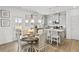Open-concept kitchen and dining area, stainless appliances, and a breakfast table at 379 Morgan Rd, Carrollton, GA 30116