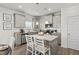 Modern kitchen with stainless steel appliances, granite countertops, and stylish gray cabinets at 379 Morgan Rd, Carrollton, GA 30116