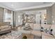 Comfortable living room with views into the kitchen and dining area, with hardwood floors and gray walls at 379 Morgan Rd, Carrollton, GA 30116