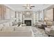 Inviting living room with a fireplace, elegant decor, plush seating, and an area rug at 379 Morgan Rd, Carrollton, GA 30116