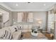 Spacious living room offering a comfortable seating arrangement and views of the staircase at 379 Morgan Rd, Carrollton, GA 30116